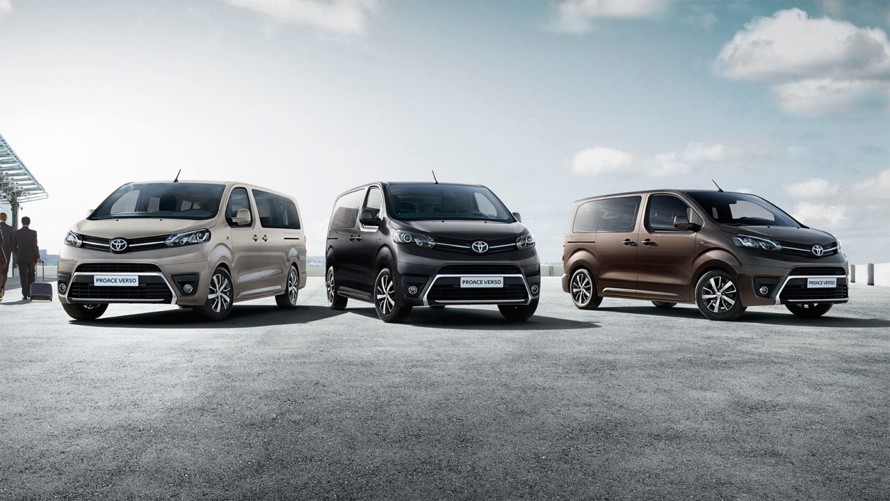 Models shown are  Proace Verso Shuttle Long in Grey Limestone (NEU),  Proace Verso VIP Medium in Misty Black (EXY) and PROACE VERSO Family Compact in Rich Brown (KCM)	